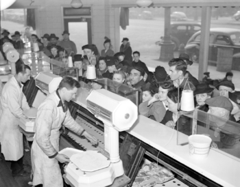 Meat counter last day before rationing, Detroit, 1943